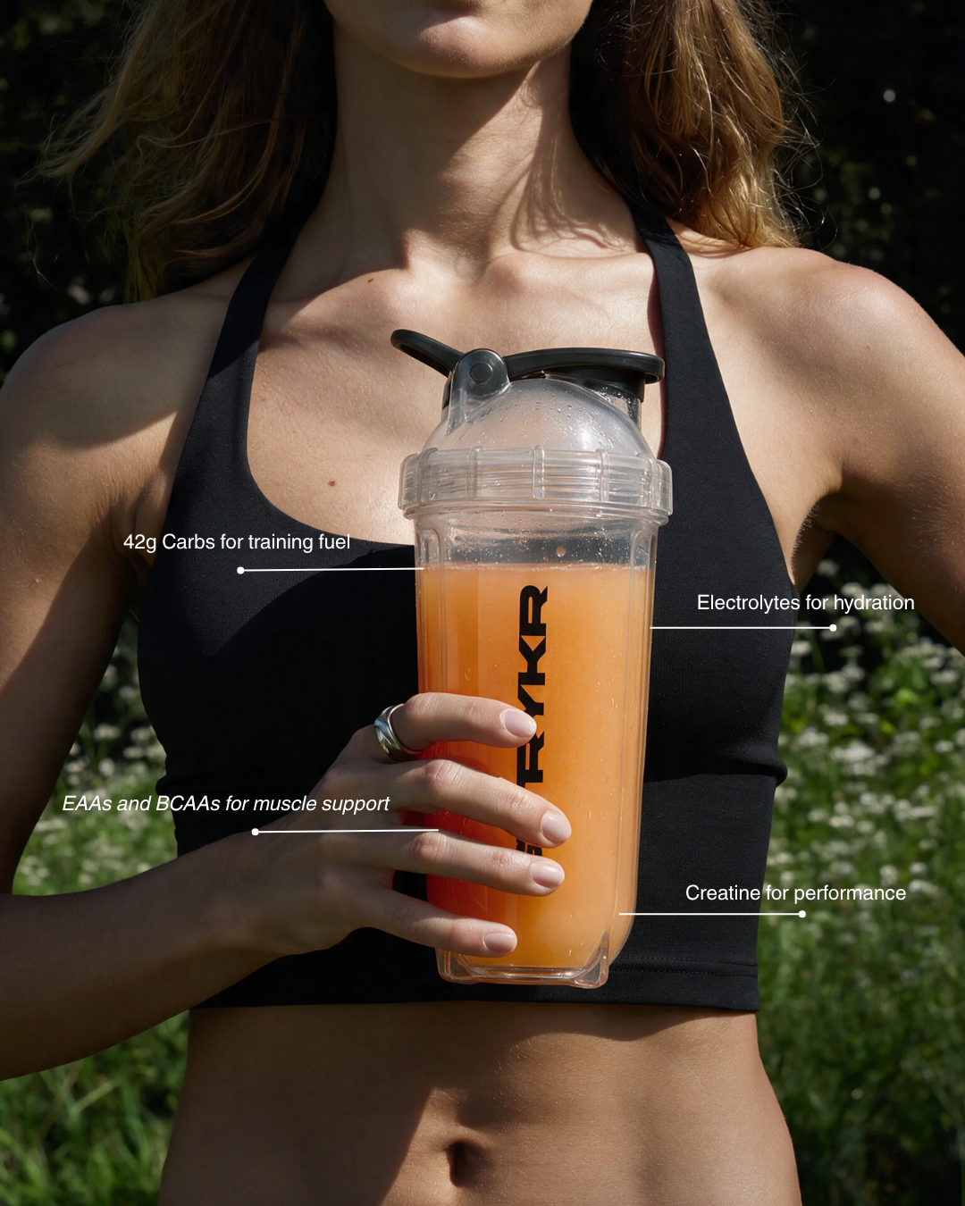 Athlete holding a STRYKR shaker with formula benefits highlighted